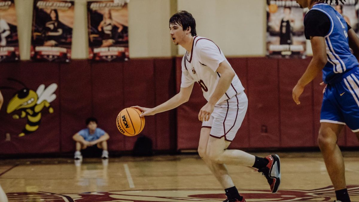 Boys basketball falls short in home opener